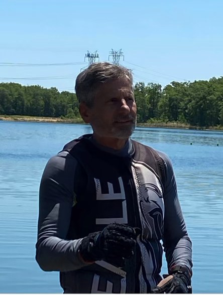 Jim at the lake, slalom course behind him